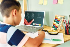 6-7 years cute child learning mathematics from computer. Homeschooling