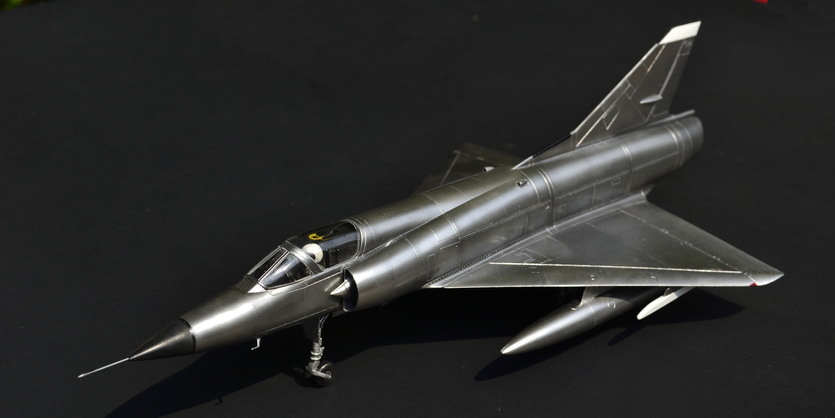 Left side of bare metallic color Mirage III model.