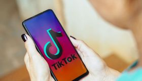 In this photo illustration, the TikTok logo is displayed on...