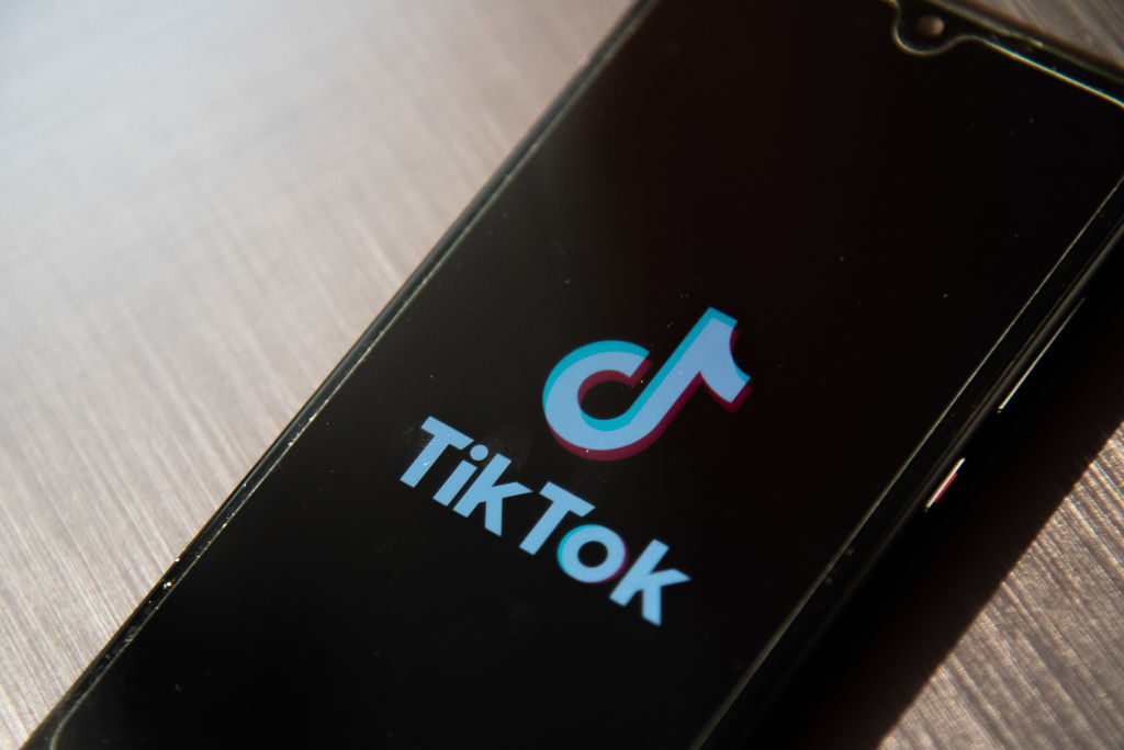 In this photo illustration, a TikTok App Logo seen displayed...