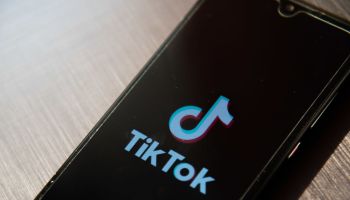 In this photo illustration, a TikTok App Logo seen displayed...
