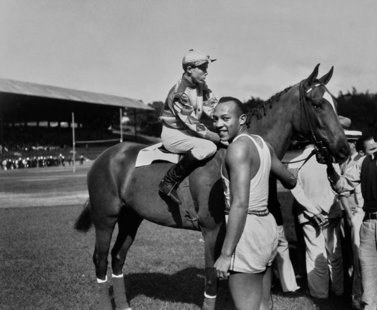 Jesse Owens - Track and Field (1936 Berlin Olympics) - 4 Gold medals (100m, 200m, long jump, 4x100m relay).