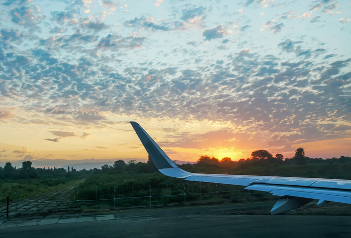 Sunrise and wing of airplane (JFK or another airport)