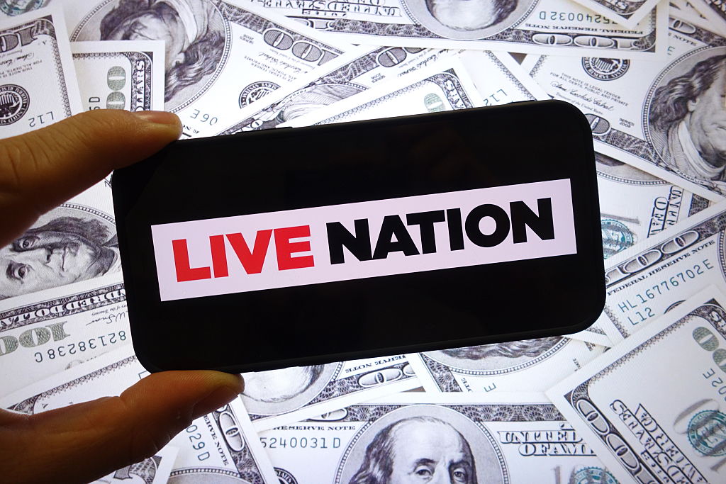 In this photo illustration, the Live Nation company logo is...