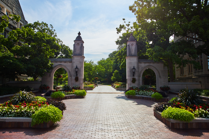 Welcome to Indiana University in Bloomington with brick boardwalk through Sample Gates