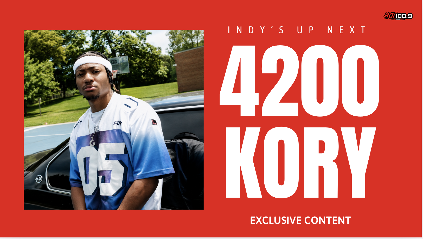 A young man wearing a white and blue jersey with the number 05 standing next to a car. The text overlay reads "INDY'S UP NEXT 4200 KORY EXCLUSIVE CONTENT".