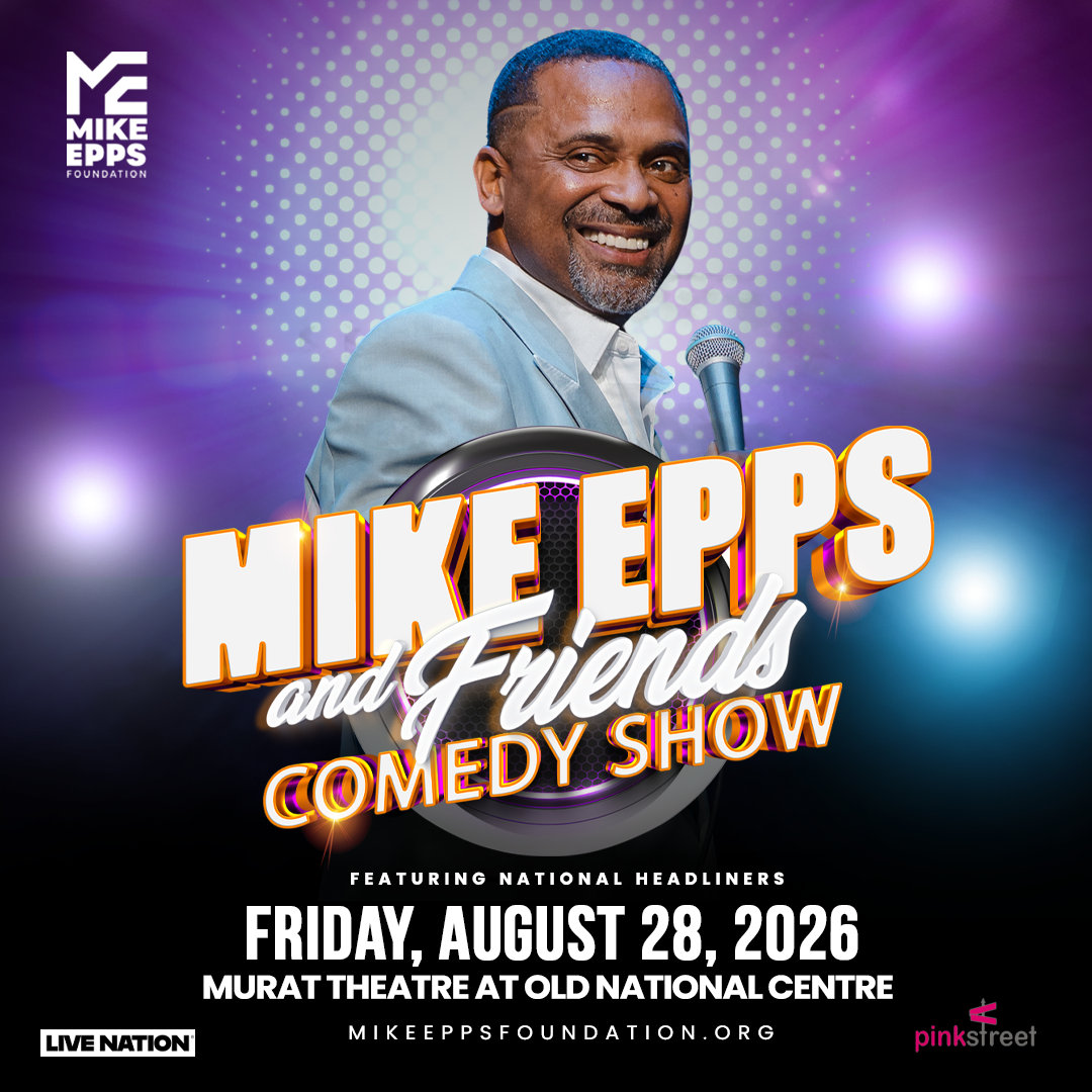 A smiling man in a suit standing at a microphone on a stage, with text reading "Mike Epps and Friends Comedy Show" and "Friday, August 28, 2026" displayed.